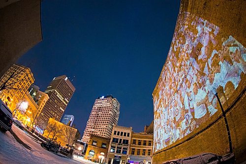 MIKAELA MACKENZIE / WINNIPEG FREE PRESS
Jets fan photos projected onto downtown buildings in Winnipeg on Thursday, April 5, 2018. 
Mikaela MacKenzie / Winnipeg Free Press 2018.