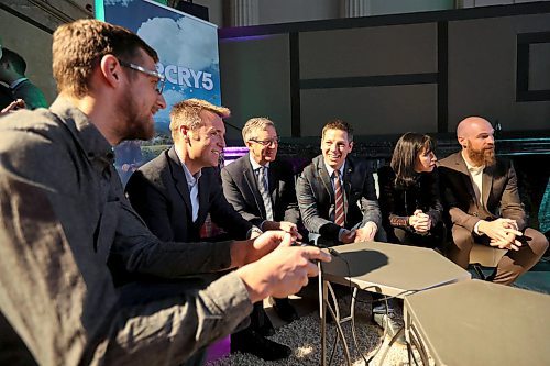 TREVOR HAGAN / WINNIPEG FREE PRESS
Maxime Durand, Historian/Coordinator with Ubisoft Canada, CEO Yannis Mallat, Minister Blaine Pederson, Mayor Brian Bowman, Economic Development Winnipeg President Dayna Spiring and Ubisoft Winnipeg Managing Director Darryl Long, looking at one of the companies games following an announcement in Winnipeg, Friday, April 6, 2018.