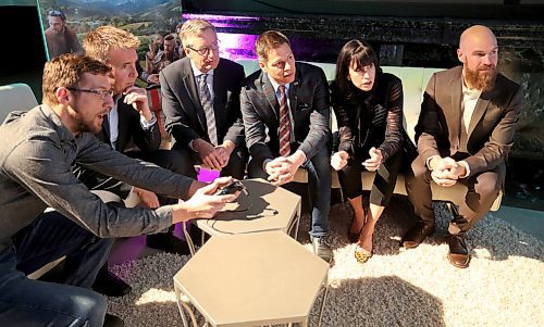 TREVOR HAGAN / WINNIPEG FREE PRESS
Maxime Durand, Historian/Coordinator with Ubisoft Canada, CEO Yannis Mallat, Minister Blaine Pederson, Mayor Brian Bowman, Economic Development Winnipeg President Dayna Spiring and Ubisoft Winnipeg Managing Director Darryl Long, looking at one of the companies games following an announcement in Winnipeg, Friday, April 6, 2018.