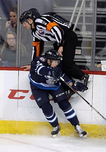 TREVOR HAGAN / WINNIPEG FREE PRESS
Manitoba Moose' Darren Kramer (22) gets tangled up with referee Beaudry Halkidis (32) during first period AHL hockey action against the Bakersfield Condors, Sunday, April 8, 2018.