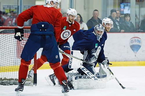 Winnipeg Jets goaltender Connor Hellebuyck (37) plays goal during a round one playoff practice in Winnipeg on Monday, April 9, 2018. THE CANADIAN PRESS/John Woods