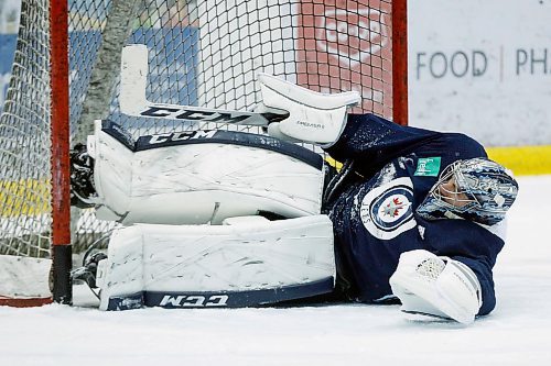 Winnipeg Jets goaltender Connor Hellebuyck (37) plays goal during a round one playoff practice in Winnipeg on Monday, April 9, 2018. THE CANADIAN PRESS/John Woods