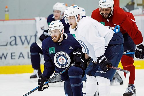 Winnipeg Jets' Bryan Little (18), Nikolaj Ehlers (27) and Dustin Byfuglien (33) look on during round one playoff practice in Winnipeg on Monday, April 9, 2018. THE CANADIAN PRESS/John Woods