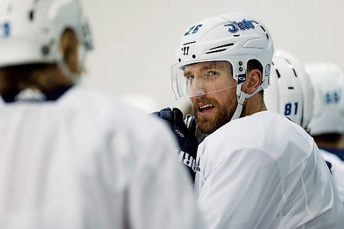 Winnipeg Jets' Blake Wheeler (26) talks with Patrik Laine (29) during a round one playoff practice in Winnipeg on Monday, April 9, 2018. THE CANADIAN PRESS/John Woods