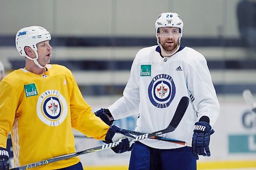 Winnipeg Jets' Matt Hendricks (15) and Blake Wheeler (26) skate during a round one playoff practice in Winnipeg on Monday, April 9, 2018. THE CANADIAN PRESS/John Woods