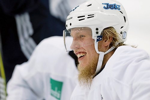 Winnipeg Jets' Patrik Laine (29) smiles during a round one playoff practice in Winnipeg on Monday, April 9, 2018. THE CANADIAN PRESS/John Woods