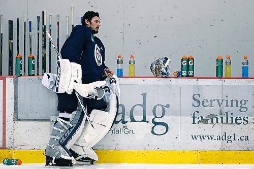 Winnipeg Jets goaltender Connor Hellebuyck (37) takes a break during a round one playoff practice in Winnipeg on Monday, April 9, 2018. THE CANADIAN PRESS/John Woods