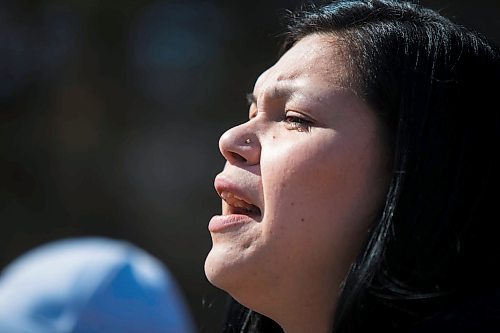 MIKAELA MACKENZIE / WINNIPEG FREE PRESS
A tear glistens in her eye as Camille Munro sings a travelling song at the #stopmeth walk travelling down Main Street in Rivergrove in Winnipeg on Monday, April 9, 2018. 
Mikaela MacKenzie / Winnipeg Free Press 2018.