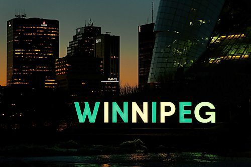 JOHN WOODS / WINNIPEG FREE PRESS
Winnipeg sign at the Forks is lit in green in yellow in honour of the Humboldt Broncos bus accident victims Monday, April 9, 2018.