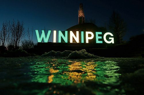 JOHN WOODS / WINNIPEG FREE PRESS
Winnipeg sign at the Forks is lit in green in yellow in honour of the Humboldt Broncos bus accident victims Monday, April 9, 2018.