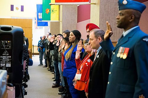MIKAELA MACKENZIE / WINNIPEG FREE PRESS
80 new citizens take the oath at a special citizenship ceremony at the VIA Rail Station in Winnipeg on Tuesday, April 10, 2018. 
Mikaela MacKenzie / Winnipeg Free Press 2018.