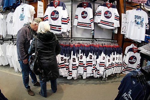 JOHN WOODS / WINNIPEG FREE PRESS
show off their gear in preparation for the White Out at the Winnipeg Jets' first playoff game against the Minnesota Wild Tuesday, April 10, 2018.
