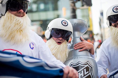 MIKAELA MACKENZIE / WINNIPEG FREE PRESS
Cody Laschyn (centre) and friends Normal Lavallee (left) and Tyler MacFarlane wait for the Jets whiteout party get started on Donald Street in Winnipeg on Wednesday, April 11, 2018. 
Mikaela MacKenzie / Winnipeg Free Press 2018.