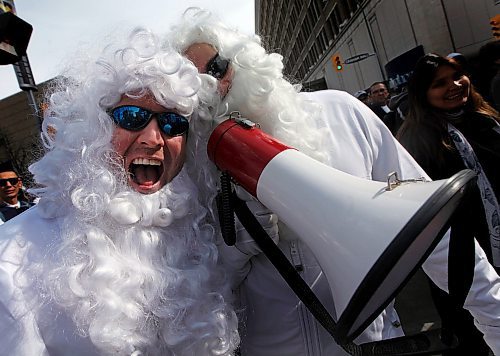 PHIL HOSSACK / WINNIPEG FREE PRESS - Jets fans Dan Linklater (left) gets into the whiteout spirit with buddy Justin Anderson at the Jet's Street Party on Donald Street Wednesday afternoon. See story.   - April 11, 2018