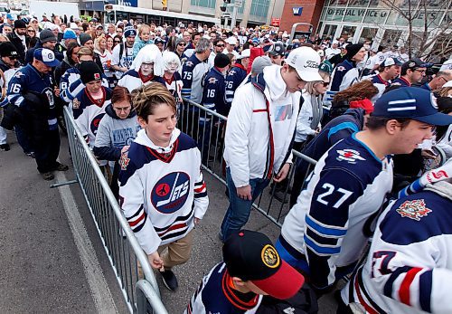 PHIL HOSSACK / WINNIPEG FREE PRESS - Jets fans with and without game seats file into the Jet's Street Party on Donald Street Wednesday afternoon. See story.   - April 11, 2018