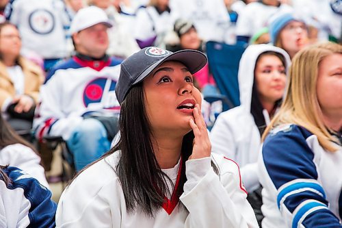 MIKAELA MACKENZIE / WINNIPEG FREE PRESS
Sheena Abella watches the game at the Jets whiteout party on Donald Street in Winnipeg on Wednesday, April 11, 2018. 
Mikaela MacKenzie / Winnipeg Free Press 2018.