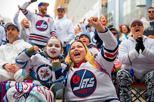 MIKAELA MACKENZIE / WINNIPEG FREE PRESS
Danielle (left) and Lacey Lavallee cheer as the game starts at the Jets whiteout party on Donald Street in Winnipeg on Wednesday, April 11, 2018. 
Mikaela MacKenzie / Winnipeg Free Press 2018.