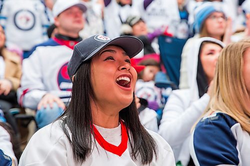 MIKAELA MACKENZIE / WINNIPEG FREE PRESS
Sheena Abella watches the game at the Jets whiteout party on Donald Street in Winnipeg on Wednesday, April 11, 2018. 
Mikaela MacKenzie / Winnipeg Free Press 2018.