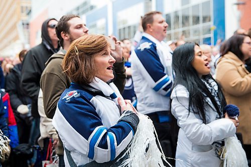 MIKAELA MACKENZIE / WINNIPEG FREE PRESS
Tammie Beauchemin sings the anthem at the Jets whiteout party on Donald Street in Winnipeg on Wednesday, April 11, 2018. 
Mikaela MacKenzie / Winnipeg Free Press 2018.