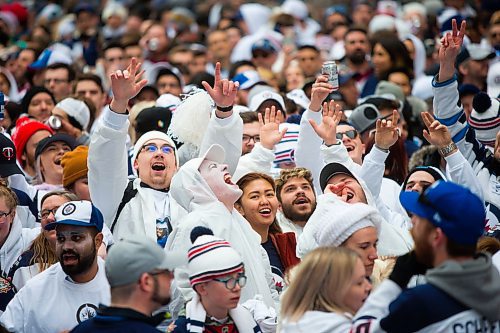 MIKAELA MACKENZIE / WINNIPEG FREE PRESS
Fans cheer at the Jets whiteout party on Donald Street in Winnipeg on Wednesday, April 11, 2018. 
Mikaela MacKenzie / Winnipeg Free Press 2018.