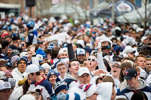 MIKAELA MACKENZIE / WINNIPEG FREE PRESS
Fans cheer at the Jets whiteout party on Donald Street in Winnipeg on Wednesday, April 11, 2018. 
Mikaela MacKenzie / Winnipeg Free Press 2018.