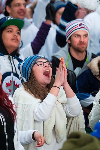 MIKAELA MACKENZIE / WINNIPEG FREE PRESS
Teagan Ewatski cheers as the Jets score the first goal of the game at the Jets whiteout party on Donald Street in Winnipeg on Wednesday, April 11, 2018. 
Mikaela MacKenzie / Winnipeg Free Press 2018.