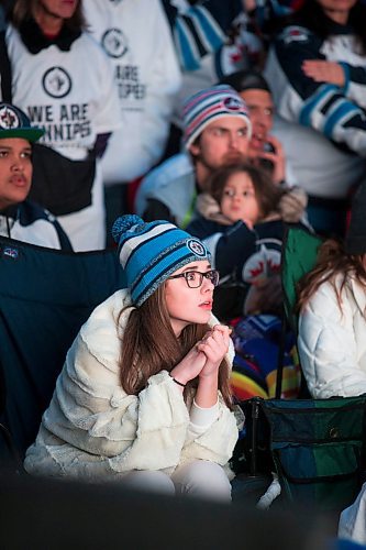 MIKAELA MACKENZIE / WINNIPEG FREE PRESS
Teagan Ewatski watches the game intently at the Jets whiteout party on Donald Street in Winnipeg on Wednesday, April 11, 2018. 
Mikaela MacKenzie / Winnipeg Free Press 2018.