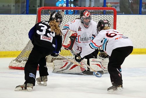 TREVOR HAGAN / WINNIPEG FREE PRESS
Richmond Hill Lightning's Clare Palmer (33) fires a shot on Manitoba Intacts' goaltender Amy Clarkson (33) as Karlee Jansen (63) tries to break up the play during their NRL division Canadian Ringette Championships game at Seven Oaks Arena, Thursday, April 12, 2018. Sports AGATE.
