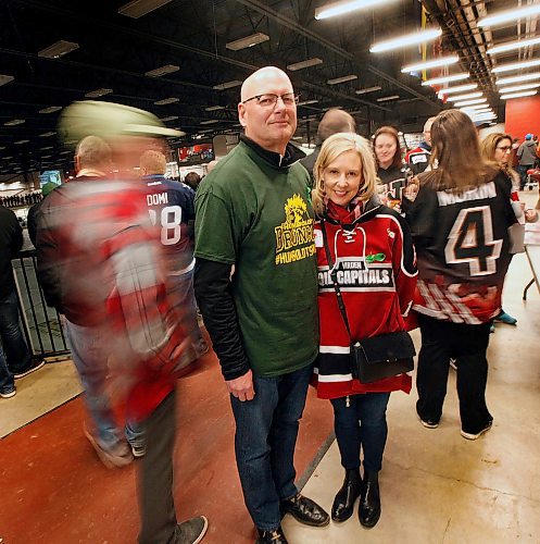 PHIL HOSSACK / WINNIPEG FREE PRESS -  Parents of Virden Oil Capitols Riley McVeigh, Cam and Shelly McVeigh pose in the concourse at the Virden Tundra Oil Gas Place  Thursday. In town from Calgary to support their son they plan on carrying on to Steinbach for the third game Saturday in the final MJHL series. Melissa Martin story.- April 12, 2018