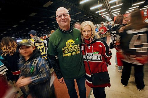 PHIL HOSSACK / WINNIPEG FREE PRESS -  Parents of Virden Oil Capitols Riley McVeigh, Cam and Shelly McVeigh pose in the concourse at the Virden Tundra Oil Gas Place  Thursday. In town from Calgary to support their son they plan on carrying on to Steinbach for the third game Saturday in the final MJHL series. Melissa Martin story.- April 12, 2018