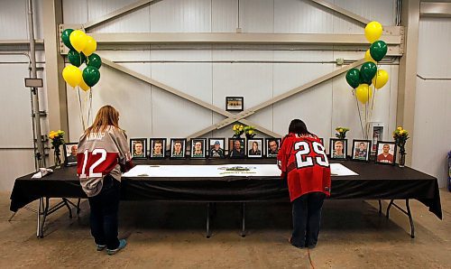PHIL HOSSACK / WINNIPEG FREE PRESS -  Virden Oil Capitol fans sign a tribute card to the Humbolt Broncos at the Virden Tundra Oil Gas Place  Thursday. Melissa Martin story.- April 12, 2018