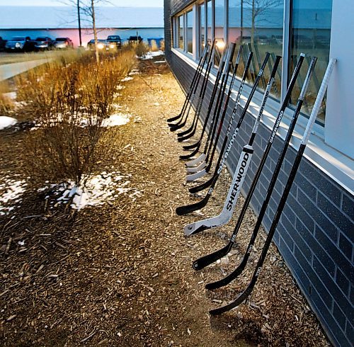 PHIL HOSSACK / WINNIPEG FREE PRESS -  16 hockey sticks lined up at the at the Virden Tundra Oil Gas Place Thursday. Melissa Martin story.- April 12, 2018