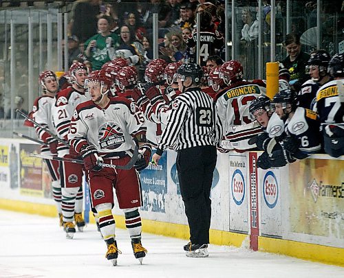 PHIL HOSSACK / WINNIPEG FREE PRESS -  Virden Oil Capitals #15 leads his line past the bench after scoring the tying goal against the Steinbach Pistons in the second period at the Virden Tundra Oil Gas Place  Thursday. Melissa Martin story.- April 12, 2018