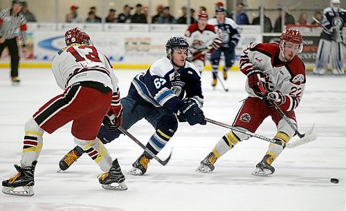 PHIL HOSSACK / WINNIPEG FREE PRESS -  Steinbach Pistons works for the puck on a drive between Virden Oil Capitals #13 Devon Becker and #22 Rylee Zimmer  at the Virden Tundra Oil Gas Place  Thursday. Melissa Martin story.- April 12, 2018