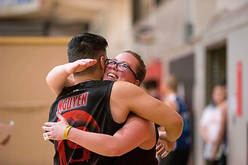 MIKAELA MACKENZIE / WINNIPEG FREE PRESS
Guylaine San Filippo, hugs Tony Nguyen at the Canadian national team dodgeball trials at the Duckworth Centre in Winnipeg on Friday, April 13, 2018. 
Mikaela MacKenzie / Winnipeg Free Press 2018.