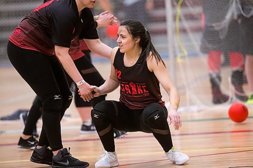 MIKAELA MACKENZIE / WINNIPEG FREE PRESS
Courtney Sarrasin gets a hand up after diving to avoid a ball at the Canadian national team dodgeball trials at the Duckworth Centre in Winnipeg on Friday, April 13, 2018. 
Mikaela MacKenzie / Winnipeg Free Press 2018.