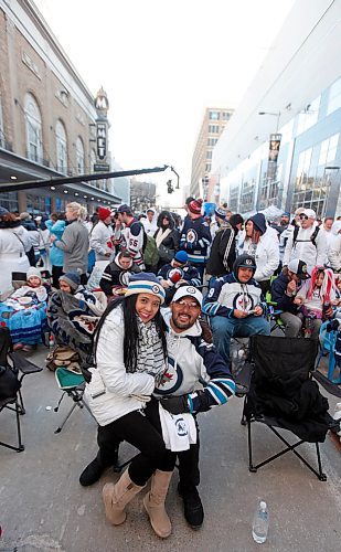 PHIL HOSSACK / WINNIPEG FREE PRESS -John and Melanie Ilag (ILAD) worked their way to front of the big screen at the Whiteout Party Friday night and snuggled up to stay warm watching game two on Donald Street Friday evening. Stand-Up - April 13, 2018