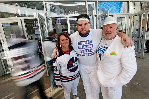 PHIL HOSSACK / WINNIPEG FREE PRESS -Riley Smith (centre) with his dad Don and Step Mom Alana Brownlee pose at the BELL/MTS centre before game two Friday evening. They're headed to Mineapolis for game three. See Ryan Thorpe's story. - April 13, 2018