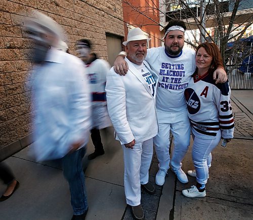 PHIL HOSSACK / WINNIPEG FREE PRESS -Riley Smith (centre) with his dad Don and Step Mom Alana Brownlee pose at the BELL/MTS centre before game two Friday evening. They're headed to Mineapolis for game three. See Ryan Thorpe's story. - April 13, 2018