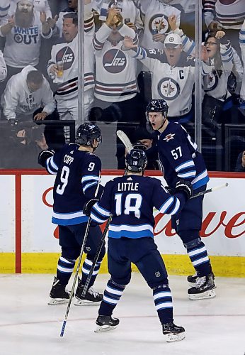 TREVOR HAGAN / WINNIPEG FREE PRESS
Winnipeg Jets' Andrew Copp (9), Bryan Little (18) and Tyler Myers (57) celebrate after Myers scored his second period goal against the Minnesota Wild during game 2 NHL play-off hockey action, Friday, April 13, 2018.