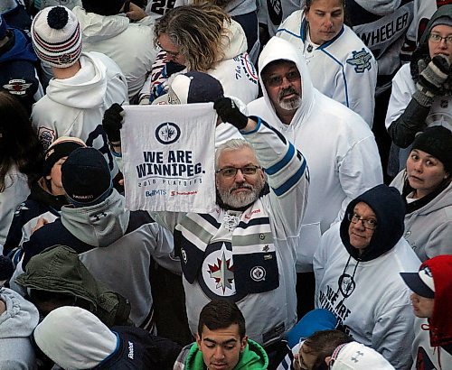 PHIL HOSSACK / WINNIPEG FREE PRESS -Showing their true colors. Jets fans pack Donald Street Friday night as the Winnipeg Jets and Minnesota Wild face off. Stand-Up - April 13, 2018