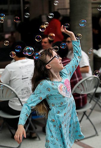 PHIL HOSSACK / WINNIPEG FREE PRESS - 7 yr old Jessica Braybrook chases bubbles Saturday morning at thefifth annual Sharing Smiles Day on Saturday at the University of Manitobas Bannatyne campus.
organized by dentistry and dental hygeinist students the event promotes dental health for Manitobans with Special needs.  Haley's mom Twyla, is a dental hygenist student and was volunteering at the event. See photo. - April 14, 2018

