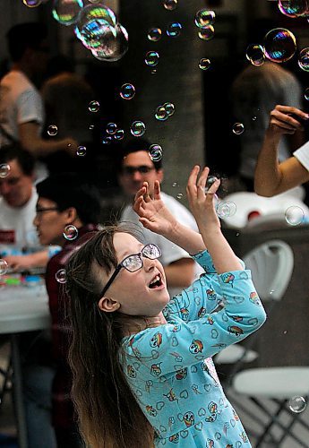 PHIL HOSSACK / WINNIPEG FREE PRESS - 7 yr old Jessica Braybrook chases bubbles Saturday morning at thefifth annual Sharing Smiles Day on Saturday at the University of Manitobas Bannatyne campus.
organized by dentistry and dental hygeinist students the event promotes dental health for Manitobans with Special needs.  Haley's mom Twyla, is a dental hygenist student and was volunteering at the event. See photo. - April 14, 2018

