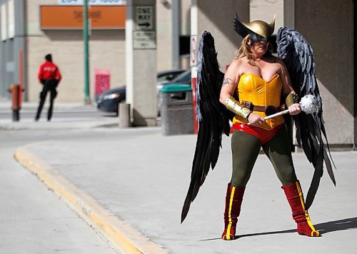 PHIL HOSSACK / WINNIPEG FREE PRESS - Comic-con Stand Up - The Justice League's "Hawk Woman" AKA Kristin Dubois, took a break from the gathering being held inside the RBC Convention Centre Saturday afternoon to pose outside for some photos with a friend and her tablet. Manitoba Comic Con, a bite-sized version of Central Canada Comic Con, is on at the convention centre from 10 a.m. to 6 p.m. Saturday and Sunday.Richard Brake, who plays the Night King (under makeup and prosthetics) on Game of Thrones, is doing autographs and pictures from 10:30 to noon both days.  - April 14, 2018
