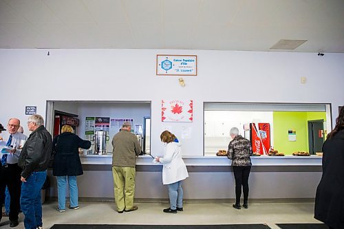 MIKAELA MACKENZIE / WINNIPEG FREE PRESS
People file into the town rec centre before Premier Brian Pallister speaks at a town hall on the proposed Lake Manitoba outlet in St. Laurent, Manitoba on Monday, April 16, 2018. 
Mikaela MacKenzie / Winnipeg Free Press 2018.