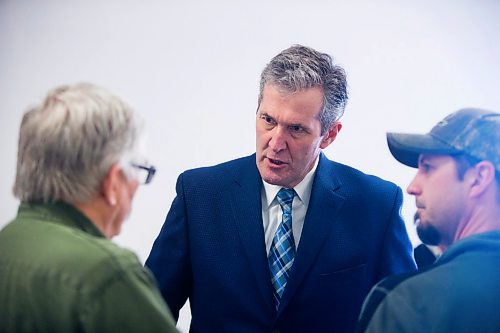 MIKAELA MACKENZIE / WINNIPEG FREE PRESS
Premier Brian Pallister says hello to people at a town hall on the proposed Lake Manitoba outlet in St. Laurent, Manitoba on Monday, April 16, 2018. 
Mikaela MacKenzie / Winnipeg Free Press 2018.