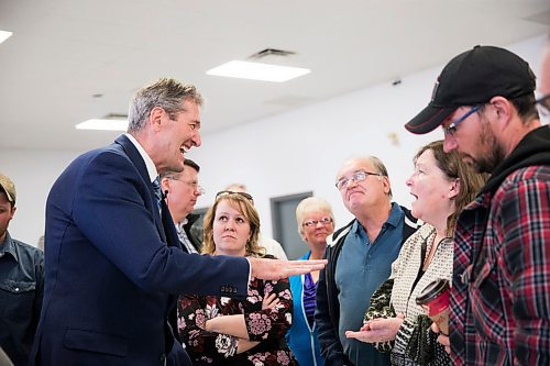 MIKAELA MACKENZIE / WINNIPEG FREE PRESS
Premier Brian Pallister speaks to Barb Weight and others listen at a town hall on the proposed Lake Manitoba outlet in St. Laurent, Manitoba on Monday, April 16, 2018. 
Mikaela MacKenzie / Winnipeg Free Press 2018.