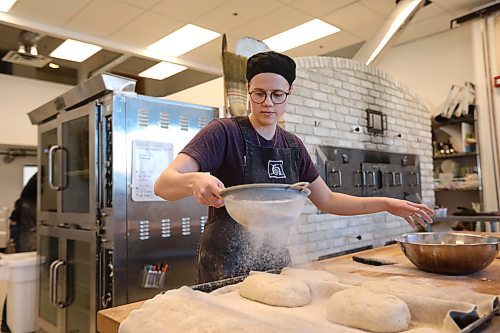 RUTH BONNEVILLE / WINNIPEG FREE PRESS
This City Sunday Special, Hildegard's Bakery at 686 Portage Ave.
Owners Dave & Judith Newsom and Michael Harms.
Various photos for feature on locally owned bakery in heart of city (Portage and Maryland).
Place used to be a car dealership, so floor to ceiling is about two stories tall; pics of the brick stove, which was built brick-by-brick, as well as varieties of breads, muffins, etc.
Baker Rebekah Friesen sprinkles flour over sourdough bread before letting it rest and rise before baking.
Dave Sanderson story.
April 16, 2018