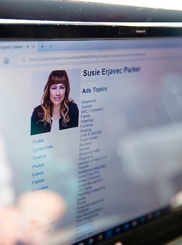 MIKAELA MACKENZIE / WINNIPEG FREE Susie Erjavec Parker, a social media specialist and owner of SPARKER Strategy Group, looks through her downloaded Facebook information in Winnipeg on Wednesday, April 18, 2018. 
Mikaela MacKenzie / Winnipeg Free Press 2018.