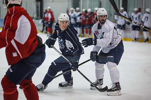 MIKE DEAL / WINNIPEG FREE PRESS
Manitoba Moose Mike Sgarbossa (4) and Nic Petan (19) during practice at the Iceplex Wednesday morning.
180418 - Wednesday, April 18, 2018.